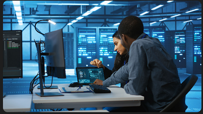 SOC analyst monitoring screens